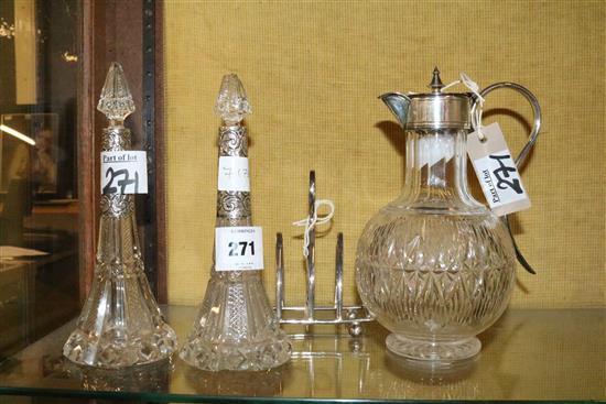 Plated mounted claret jug, toast rack, 2 silver mounted scent bottles and stoppers